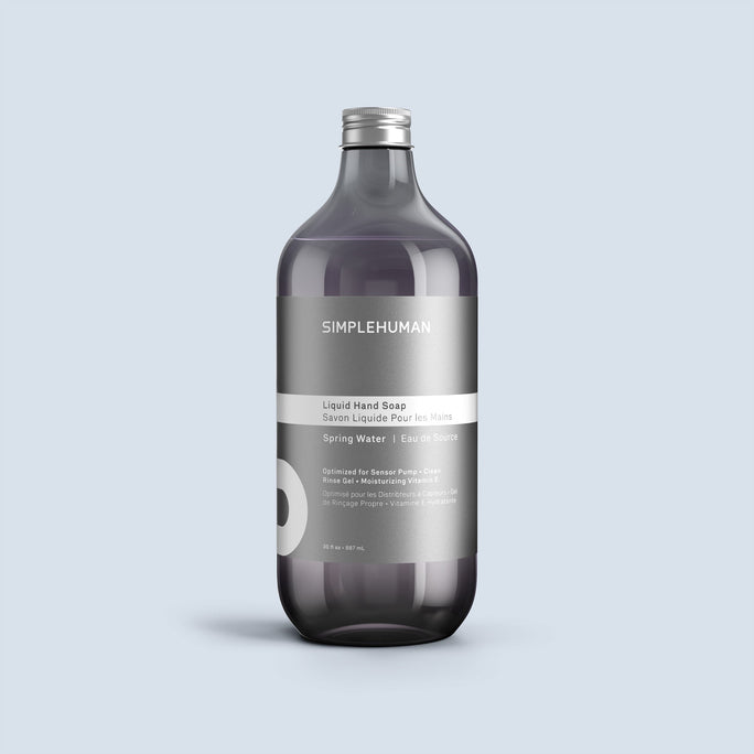 Simplehuman's Spring Water Liquid Hand Soap Refill Bottle on a colored background.