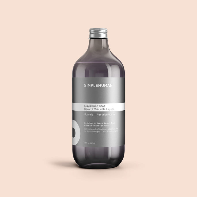 Simplehuman's Pomelo Liquid Dish Soap Refill Bottle on a colored background.