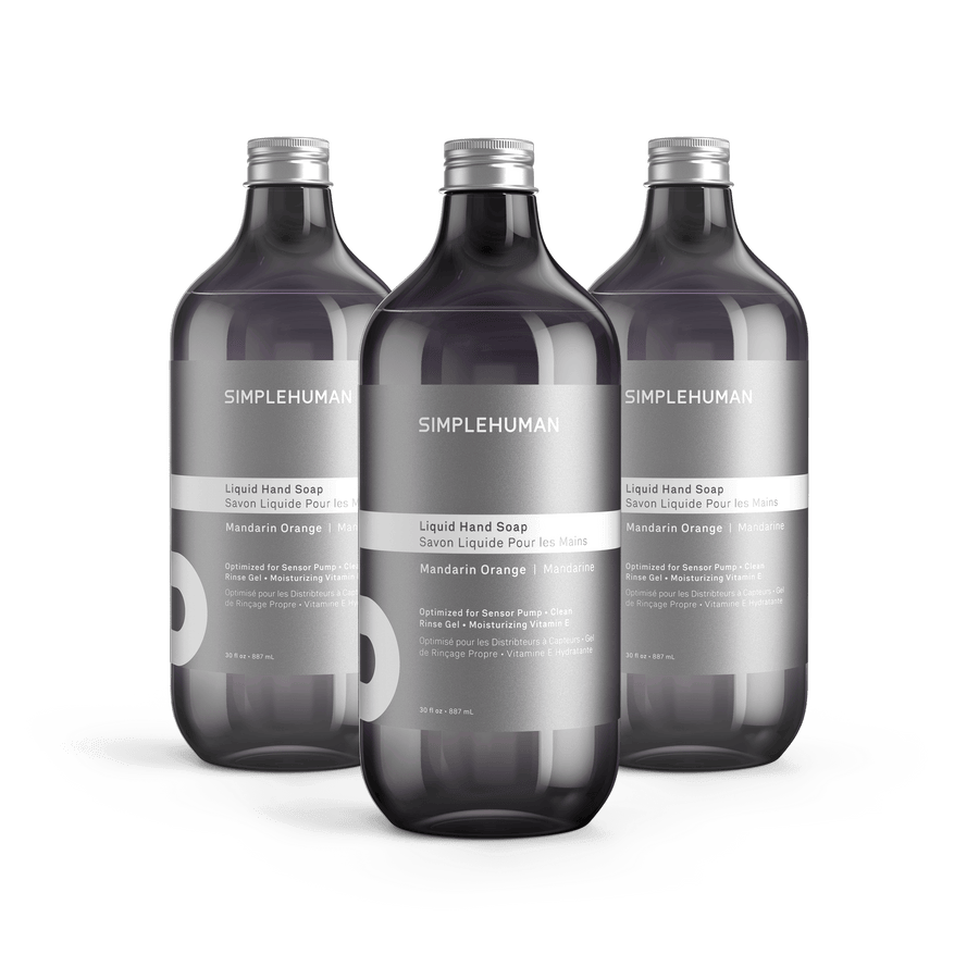 Simplehuman's Mandarin Orange Liquid Hand Soap in 3 charcoal colored bottles and titanium caps.