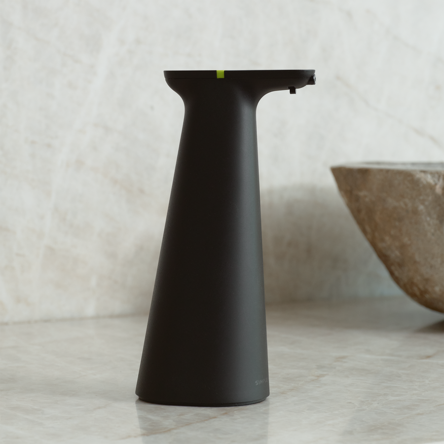 Simplehuman Matte Black Sensor Spray on marble countertop, touch-free automatic disinfectant dispenser