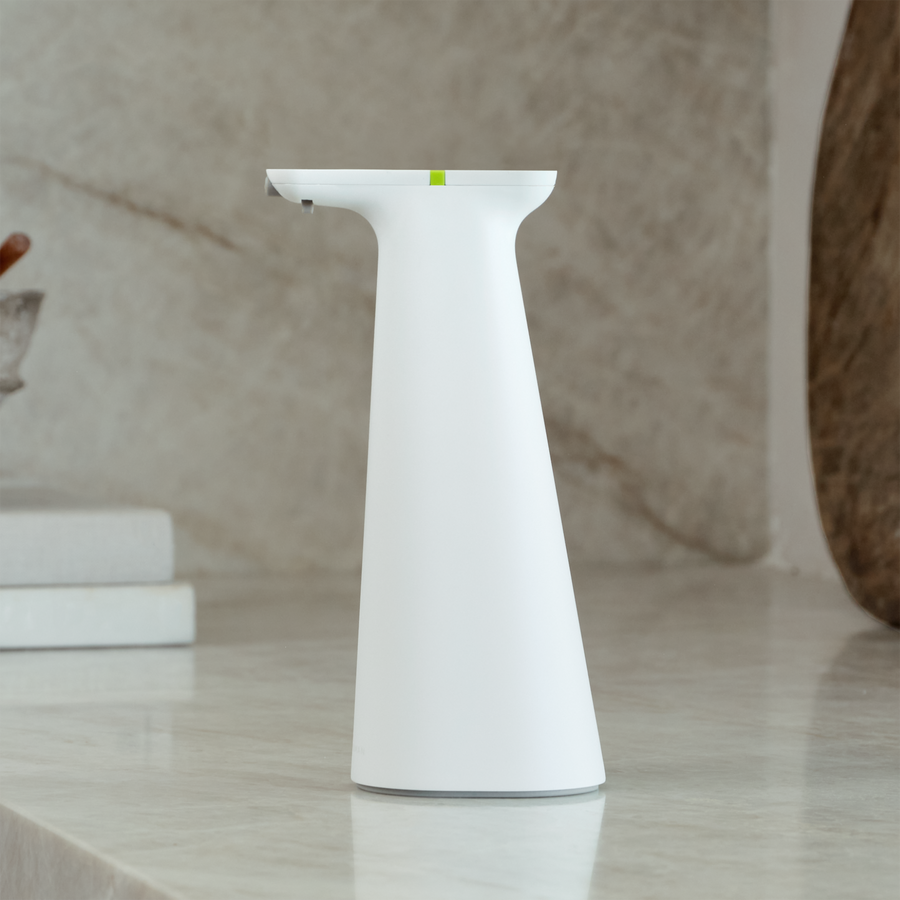 Simplehuman White Sensor Spray on modern marble countertop, touch-free automatic disinfectant dispenser