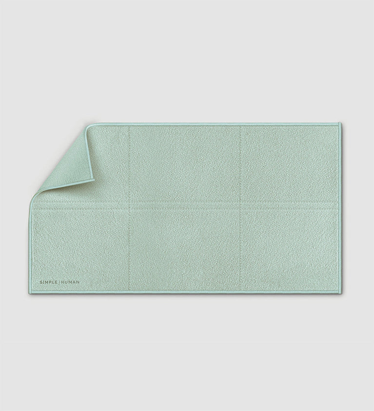 Simplehuman's clean cloth in sage green on a white background.